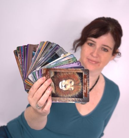 Image shows Lee-Anne Peters showing her artwork on tarot cards 