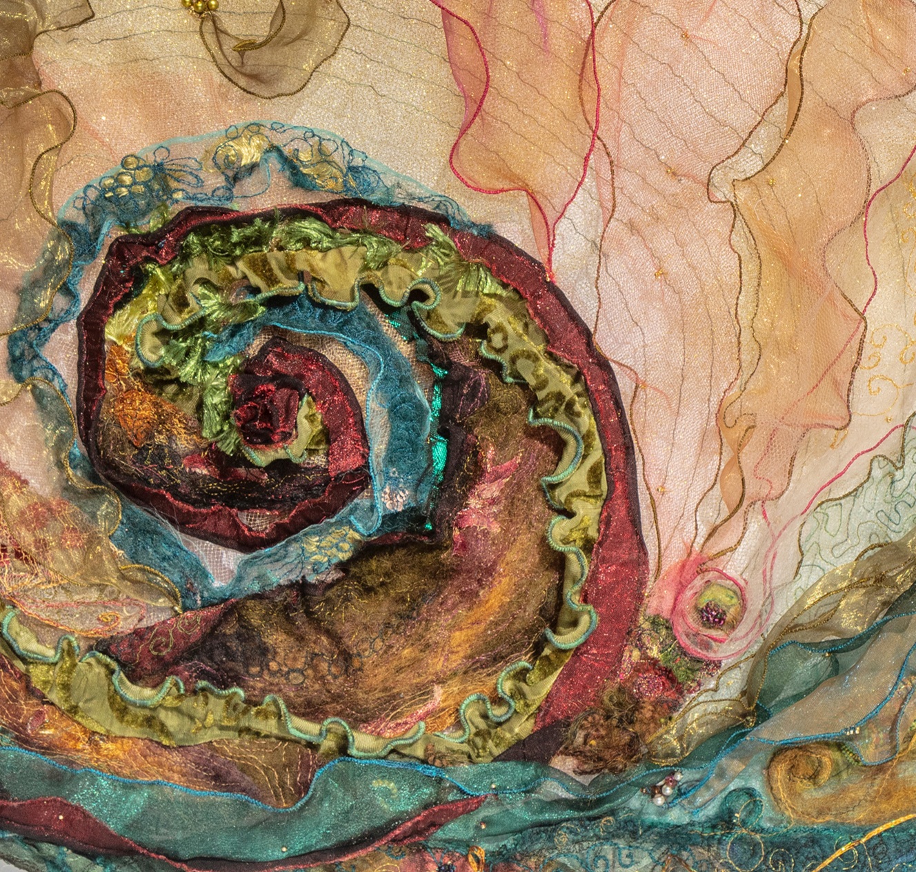 Image shows close up of a textile art abalone by Cindy Thompson for her Artist Profile with Art Trails Tasmania