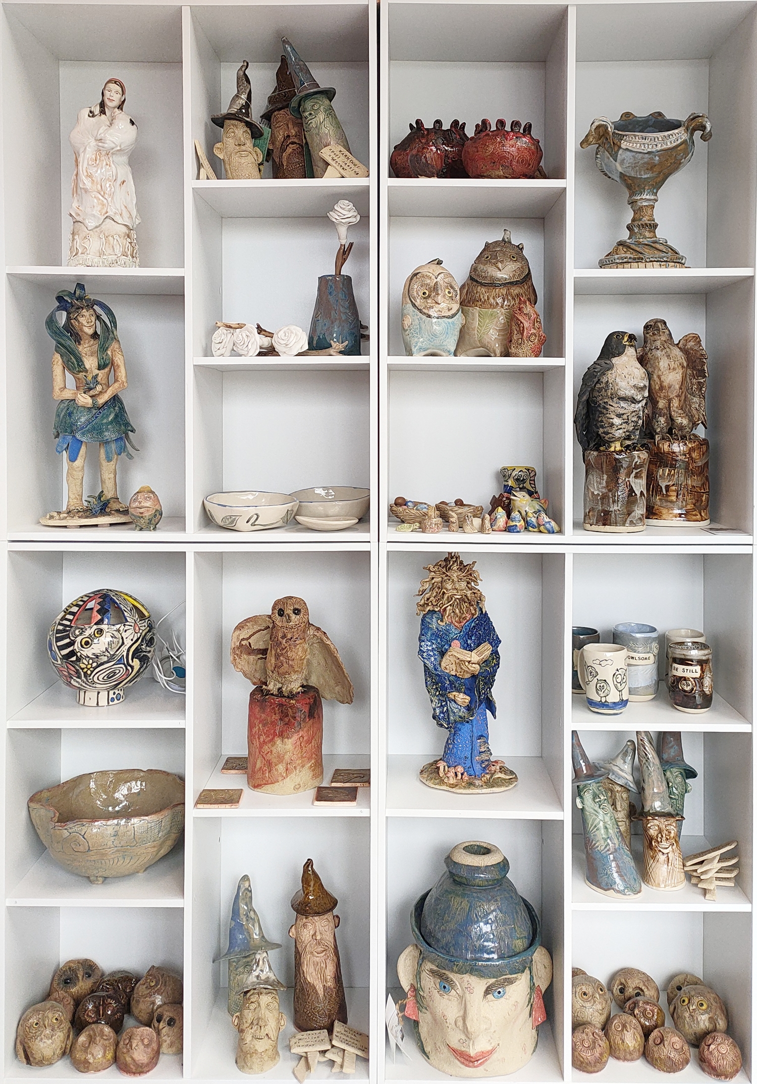Image shows a wall shelving unit displaying beautifully crafted ceramic sculptures at Lee-Anne Peters Ceramics studio Art Trails Tasmania