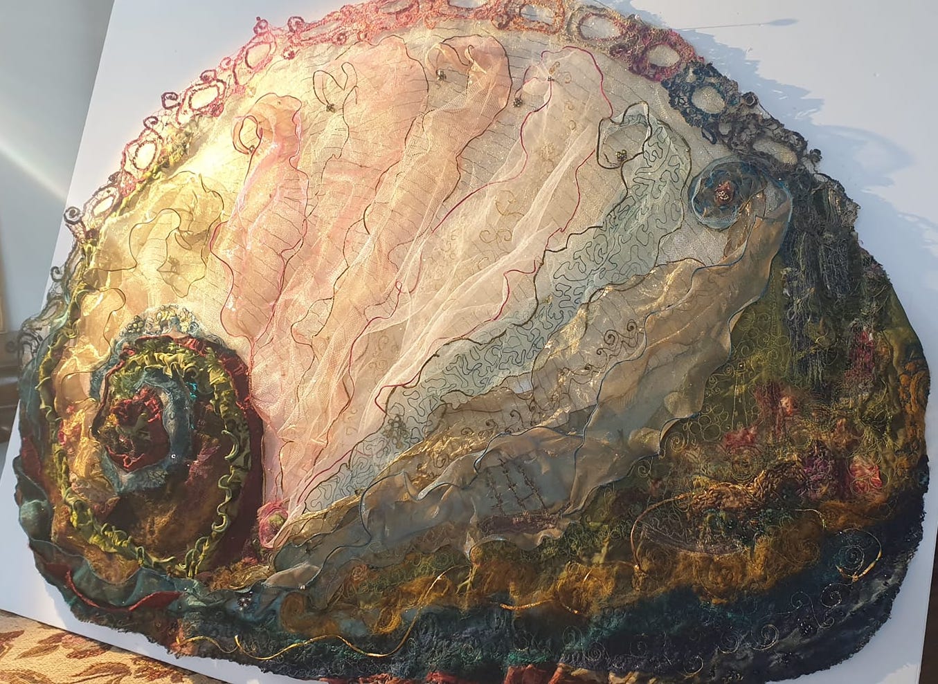 Image shows close up of a textile art abalone by Cindy Thompson for her Artist Profile with Art Trails Tasmania