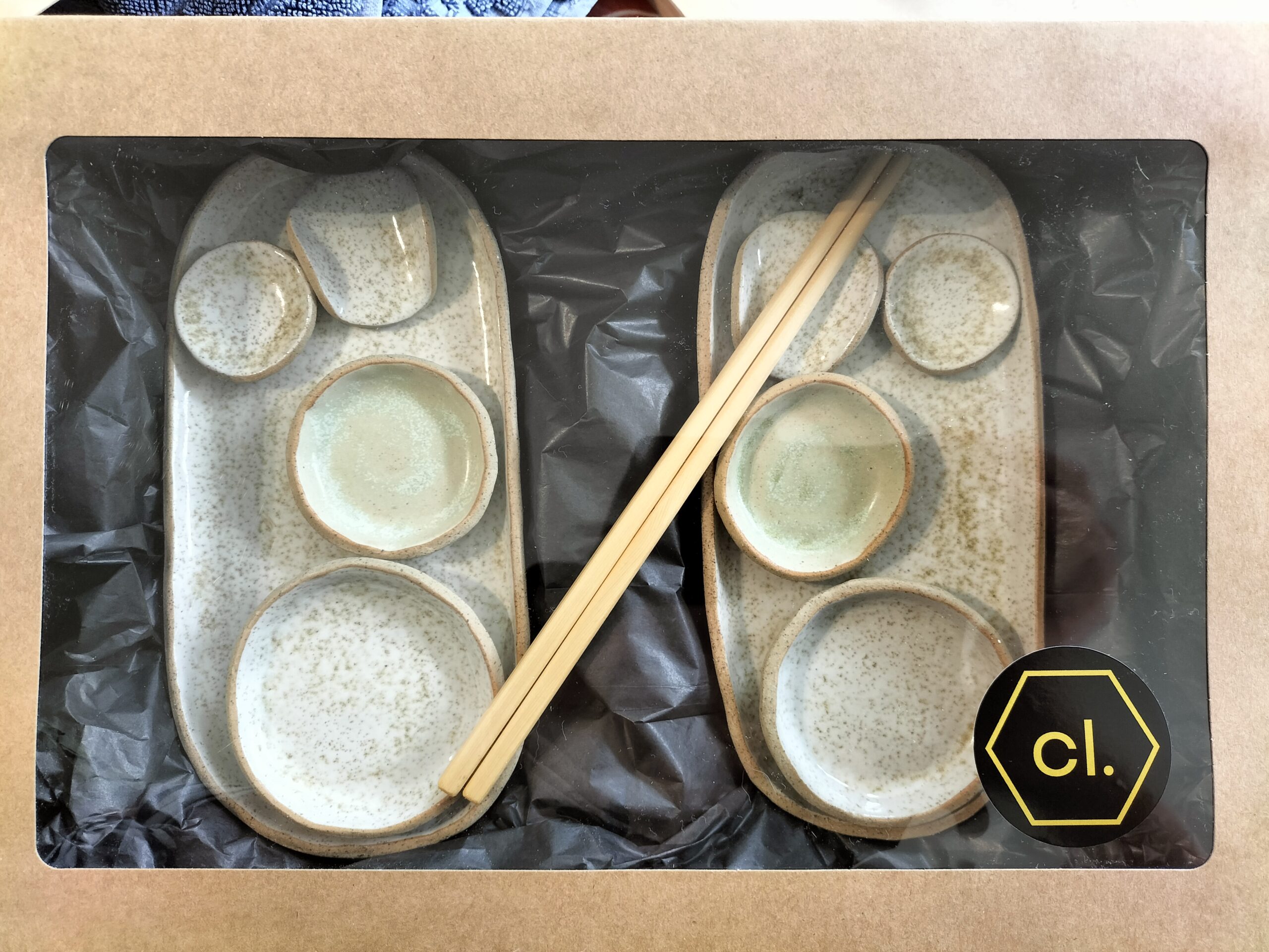 Image shows a sushi table ware set by Christie Lange in her Artist Profile Art Trails Tasmania packed in a cardboard box