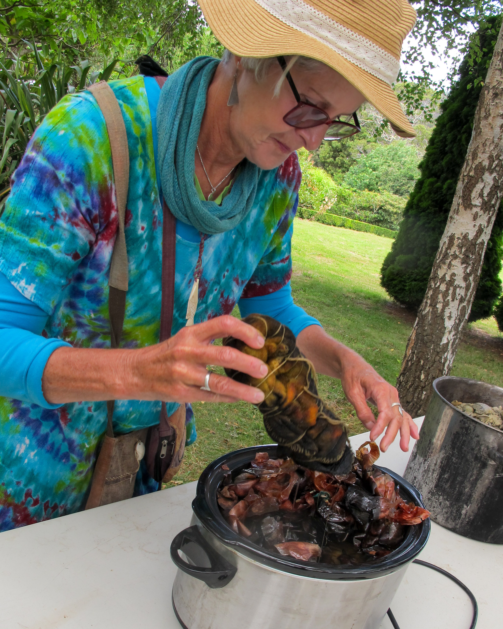The image shows textile artist Aujke Boonstra dyeing yearn for the Textile Art Retreat Found, Collected, Dyed, Stitched with Textile Artist Aujke Boonstra Art Trails Tasmania for her workshop at the Tin Dragon Trails Cottages