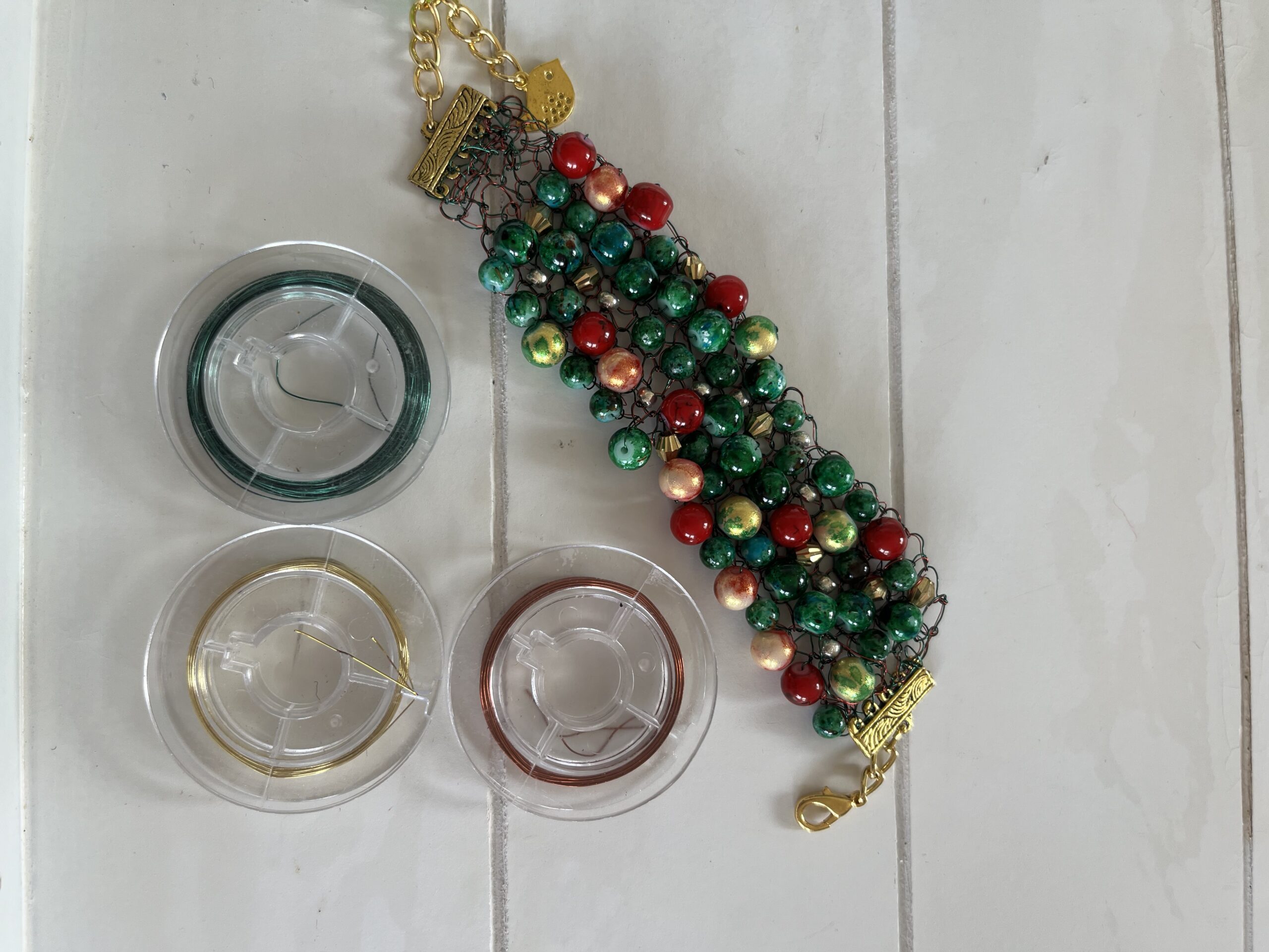 Image shows a Christmas beaded bracele for the Artist Profile An Abiding Love for Colour and Making with Noelene Hammond Art Trails Tasmania Explore Your Creativity