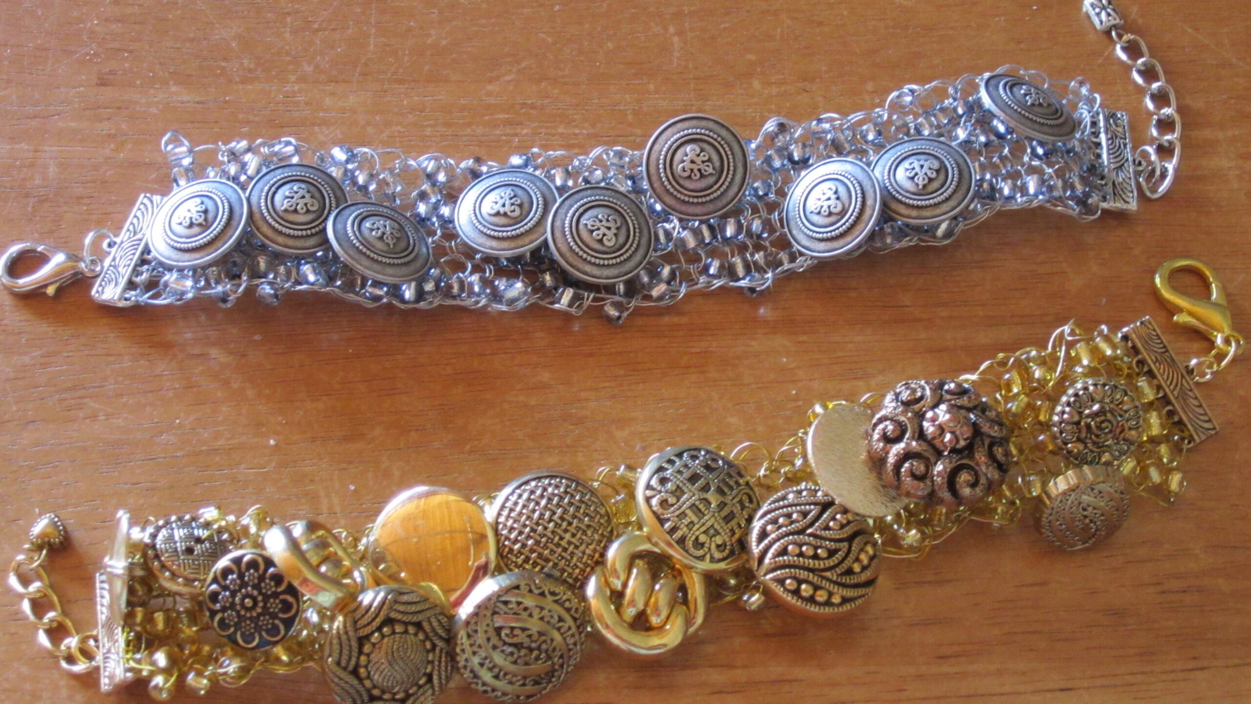 3 Noelene Hammond Workshop Story Art Trails Tasmania Explore Your Creativity Image shows a beaded necklace in reds and greens for the Artist Profile An Abiding Love for Colour and Making with Noelene Hammond Art Trails Tasmania Explore Your Creativity