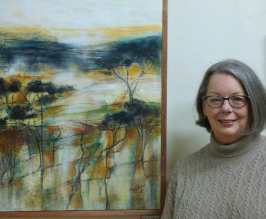 Image shows a verdant landscape with rolling green hills, blue sky with passing clouds for the Artist Profile Sharing Stories and Connections Through Bold Colours and Mark-Making with Julie McDonald Art Trails Tasmania