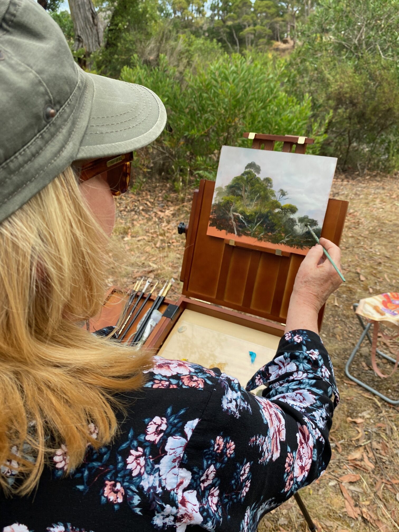 Image shows a studio view with pink roses set up for painting for the Artist Profile Sharing Stories and Connections Through Bold Colours and Mark-Making with Julie McDonald Art Trails Tasmania